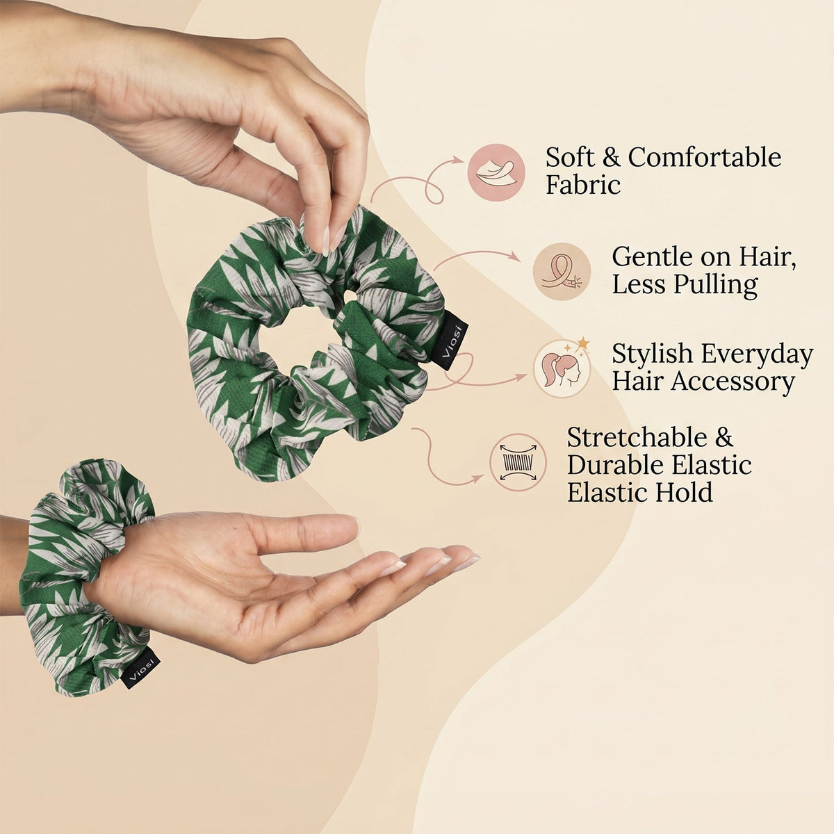 Two green and white leaf print scrunchies are held by hands, with text highlighting features like soft fabric and elastic
