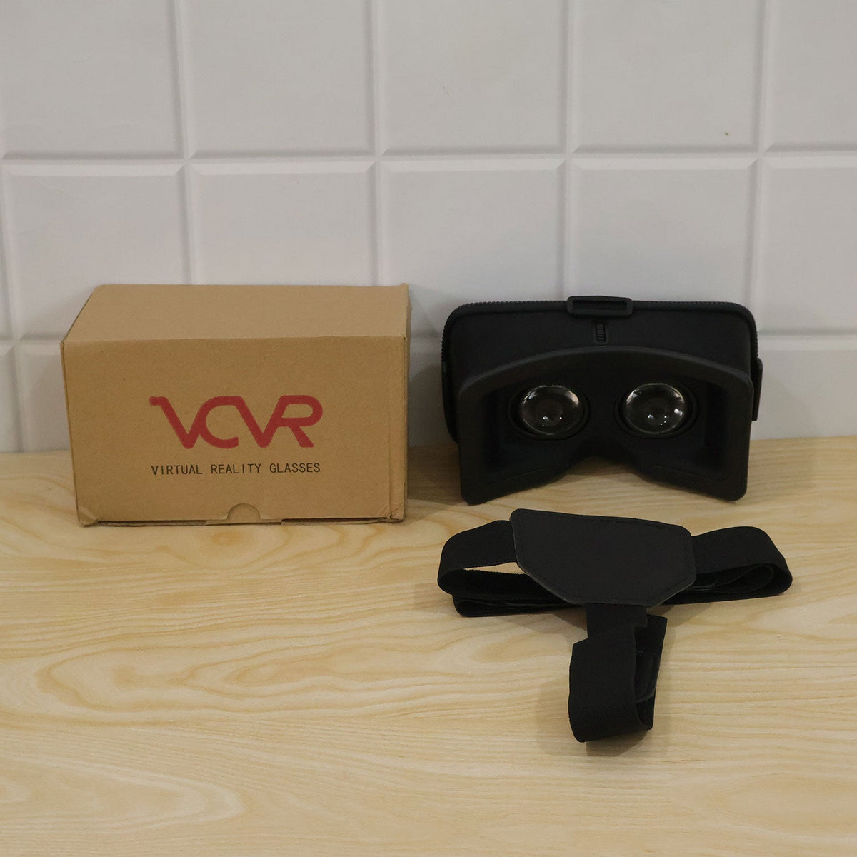 Person wearing a black virtual reality smartphone headset