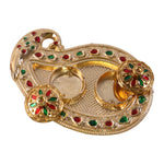 Golden Kankavati holder in use during a pooja ceremony