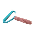 A pink and blue lint remover with a textured handle is shown on a white background.