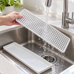 Removable drain rack being rinsed