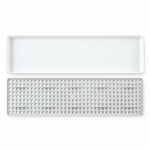 Plastic drain rack components on white background