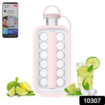A pink ice cube bottle stands upright, surrounded by fresh lime, lemon, and mint, next to a glass of iced beverage.