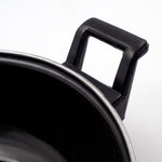 Close-up view of cast iron kadai surface highlighting seasoning