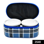 Three round stainless steel tiffin containers neatly stacked.