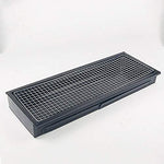 Components of the FirePot portable charcoal BBQ grill laid out for assembly.