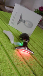 Woman applying the Neck Face Massager to her jawline for a lifting effect.