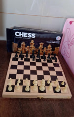 Lifestyle shot featuring the folding wooden chess set, perfect for family game nights.
