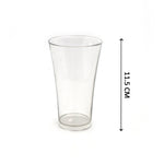 A hand holding one of the clear plastic juice glasses, demonstrating its ergonomics.