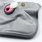 Detailed view of the electric heating pad's soft cloth material for soothing warmth.