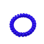 A single blue elastic telephone wire hair tie with its signature coil shape.