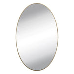 Self-adhesive frameless oval mirror sticker positioned above a dresser, perfect for dressing.