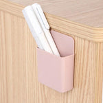 Pack of four wall mounted phone holders shown in their retail packaging.