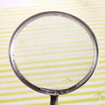 Frying filter spoon with clip, highlighting its oil straining capability.