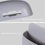 Detailed view of the wall mounted charging stand with cable slot.