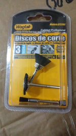 The 3-piece black nylon brush set is shown in its clear plastic and yellow cardboard retail packaging on a brown surface.