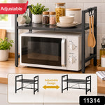 Black metal microwave oven rack with a white microwave, mugs, and spices on a wooden counter, with an "Adjustable" banner.