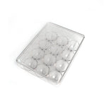 Hand placing an egg into the 12-cavity egg organiser for neat storage.