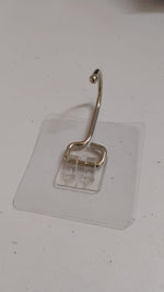 SteadyClear transparent adhesive wall hook holding towels and keys