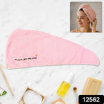 Lightweight microfiber towel wrap securing hair with button closure