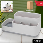 Multipurpose plastic organizer holder on a desk with office supplies.