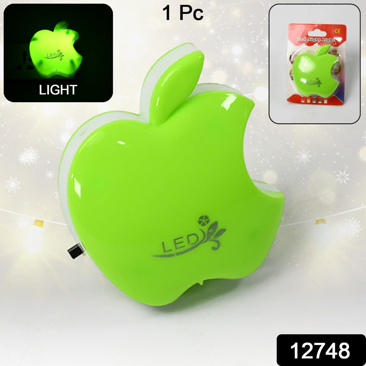 Bright green apple-shaped LED night light with a small inset image of its retail packaging.