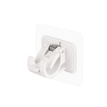 Wall-mounted adhesive towel holder showing towel rod and hooks