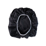 Compact rain cover shielding backpack during outdoor use
