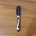 Marker pen writing with bold blue ink on smooth surface
