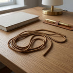 Spiral cable protector sleeve in brown, offering reliable wire protection.