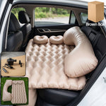 Inflated car air mattress set provides comfort in vehicle back seat.