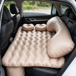 Complete car air mattress set featuring pillows and electric pump for travel.