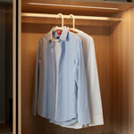 Curved anti-slip clothes hanger designed to preserve garment shape and prevent slipping