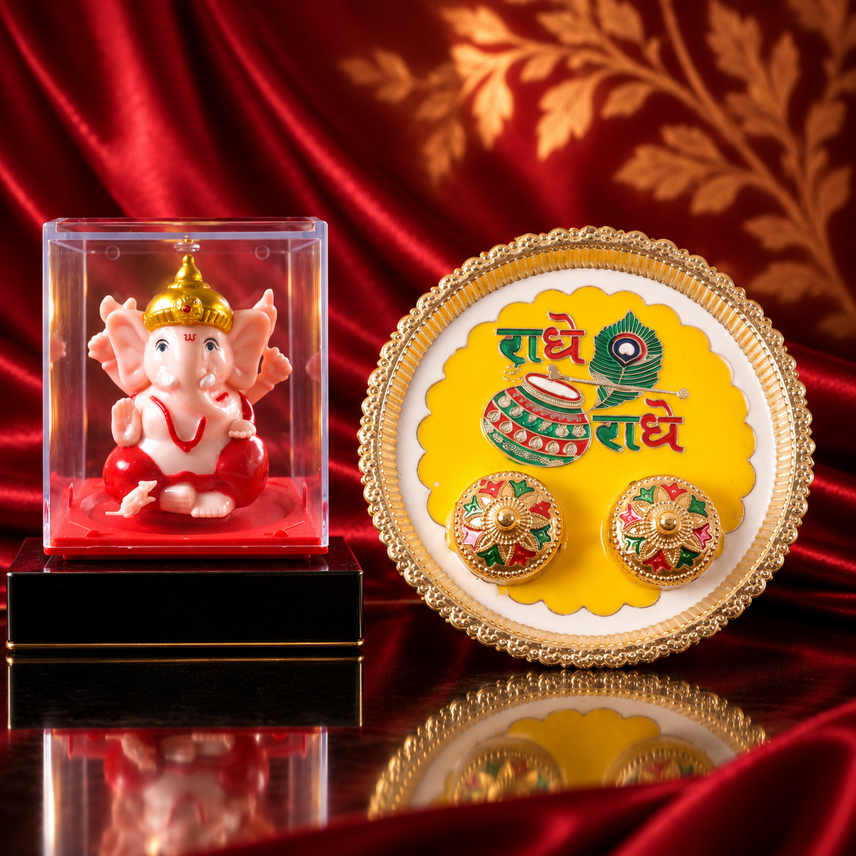 A gold-rimmed white and yellow pooja thali with Radhe Radhe text and two small containers sits on a dark surface beside a
