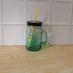 Mason Jar with Handle filled with a refreshing beverage, ready for enjoyment.