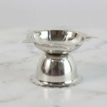 Compact decorative steel diya stand with sunflower design for rituals