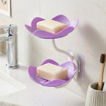 The flower shape double layer soap dish in use, neatly holding soap in a bathroom.