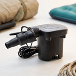 A black electric air pump with a multi-sized nozzle is shown with its dimensions, 7 cm wide and 10 cm high.