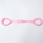 Woman using resistance band for arm exercises during workout