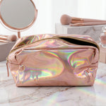 The holographic pink makeup bag is shown with its dimensions, 24 cm length and 10 cm width.