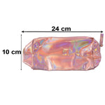 A holographic pink makeup bag lies on a marble surface next to a perfume bottle and small iridescent stones.
