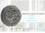 Round stainless steel scrubber shown in use, effortlessly removing tough stains from cookware.