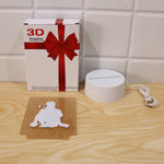 The Hanuman LED lamp components laid out: a gift box, the white base with cable, and the acrylic panel.