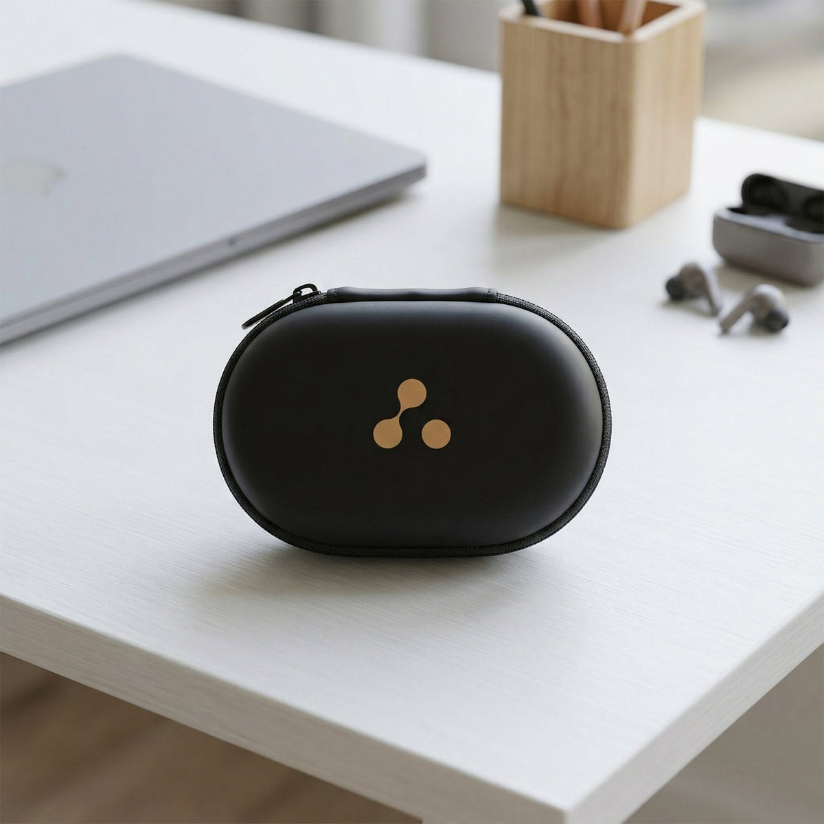 A four-panel collage shows the compact black case being placed into a bag, pocket, on a table, and hanging from a backpack.
