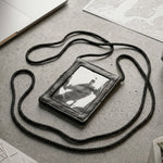 Close-up of the black PU leather neck wallet showing the clear ID window