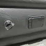 Portable inflatable bed partially folded illustrating compact and lightweight design