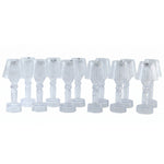 A dozen clear acrylic miniature lamps with ribbed shades are neatly displayed in rows on a plain white background.