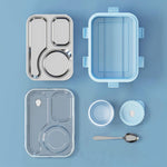 Open stainless steel lunch box showing three compartments and the bonus side container