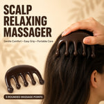 A hand massages a scalp with a dark brown resin massager, with another massager below, and text
