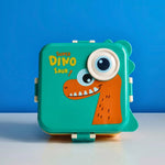 A closed green dinosaur lunchbox with a large orange dinosaur head and eye design, sitting against a blue background.